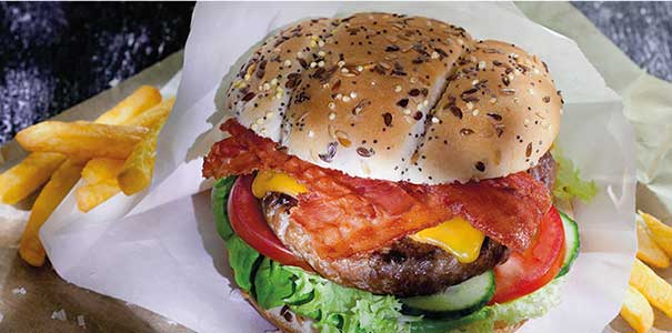 Picture of a burger with a streaky bacon slices